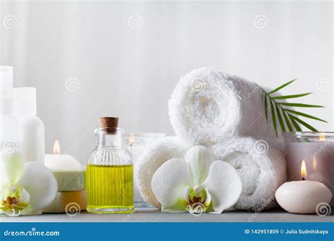 Spa Beauty Treatment And Wellness Background With Massage Oil Orchid Flowers Towels Cosmetic