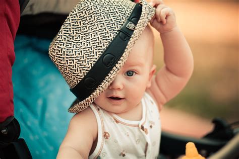 Baby In White Tank Top Holding Fedora Hat Hd Wallpaper Wallpaper Flare
