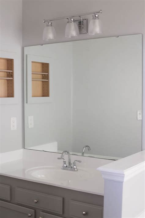 Fantastic framed mirror in a rectangular design. How to Frame a Bathroom Mirror - Easy DIY project