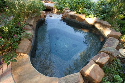Hot tub is a a large, usually wooden, container full of hot water in which more than one person can sit. Portable Hot Tubs vs. Inground Hot Tubs: Pros/Cons ...
