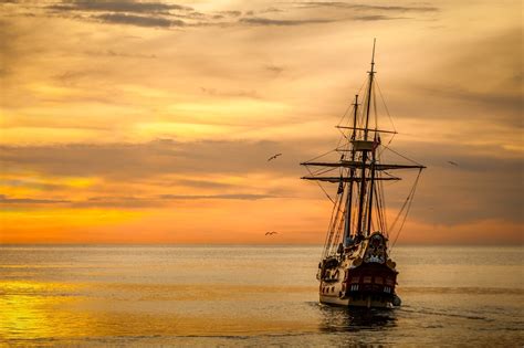 Brown Sailing Boat On The Sea During Sunset · Free Stock Photo