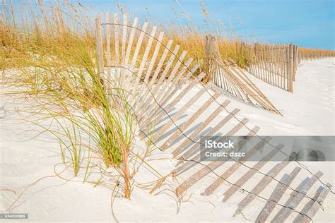 Sand Dunes Fence Grass Gulf Of Mexico Navarre Florida Beach Stock Photo