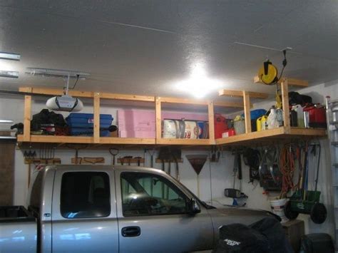 How about creating a suspended, sliding storage system where you could keep all your tools and other goodies? DIY Garage Ceiling Storage - The Owner-Builder Network