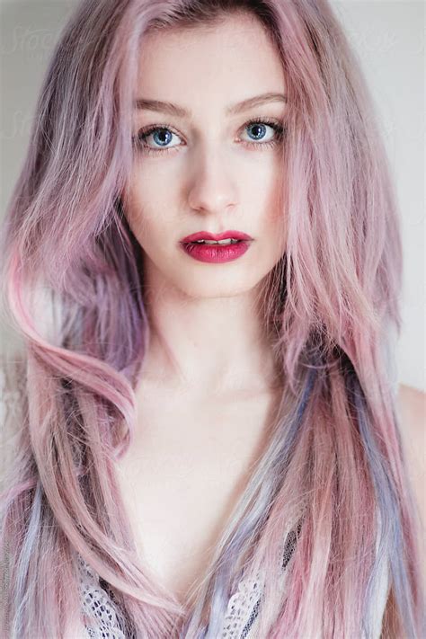 Portrait Of A Beautiful Young Woman With Blue Eyes And Pink Hair By