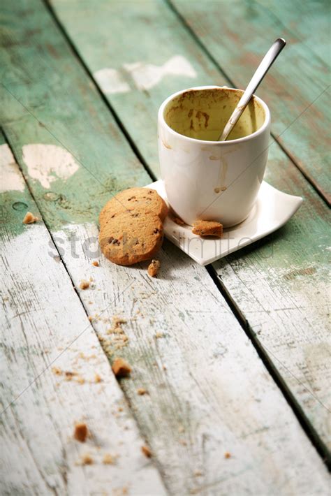 Could this be the reason why the cafe's patrons are growing? Empty coffee cup on wooden table Stock Photo - 1932101 ...