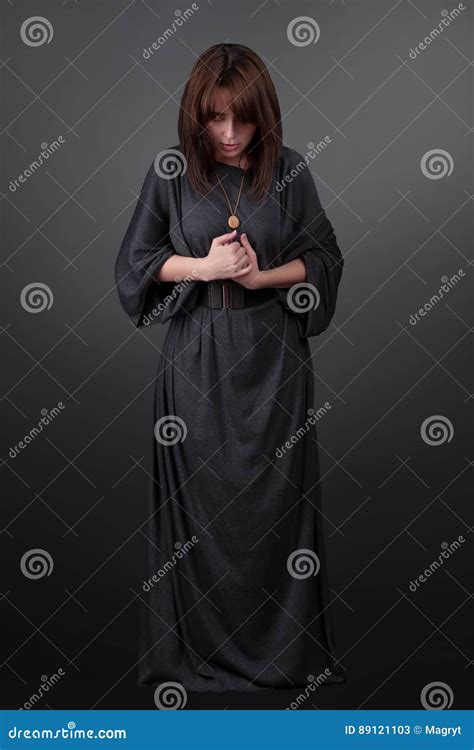 Portrait Of A Young Caucasian Woman Praying Prayer Girl Dressed In