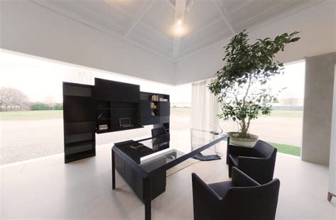When designing a black and white home office, there are 3 steps you need to go through. modern black office space with juvenille tree in pot and ...