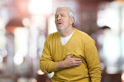 Portrait Of Old Man Suffering From Heart Attack Stock Photo Image Of