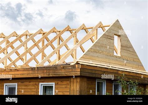 Construction New Triangular Roof Of A Wooden House In The Village Stock