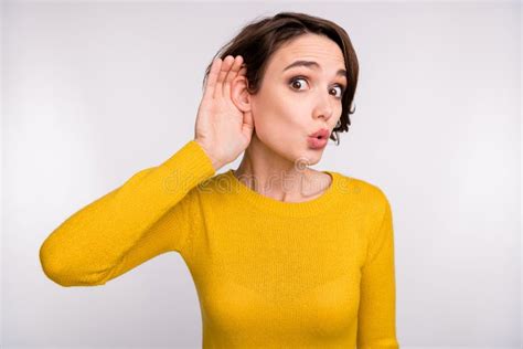 Photo Of Shocked Gossip Girl Hands Ear Eavesdropping Wear Yellow Shirt