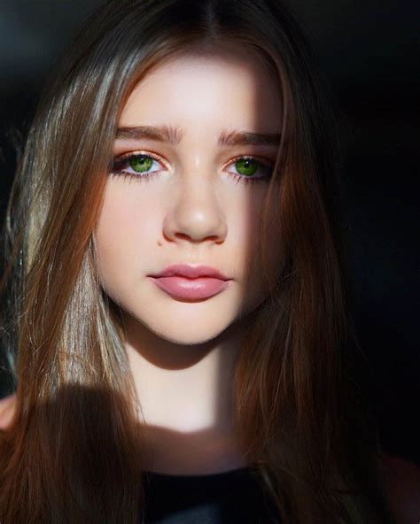 A Woman With Long Hair And Green Eyes