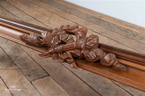 Wooden pelmet with ornate carved centrepiece
