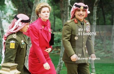 King Hussein Of Jordan Walks With His Wife Queen Noor Of Jordan And