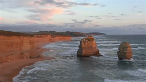 Rock Formations Known As The Twelve Apostles Stand Out On The