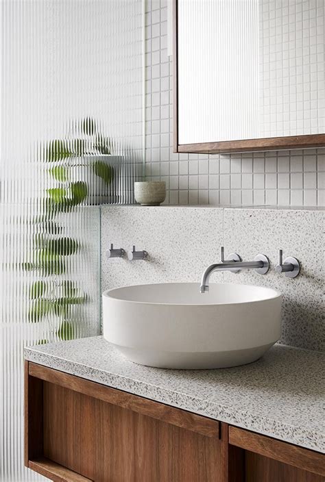 This Modern Bathroom Is Filled With Terrazzo Tiles And Countertop