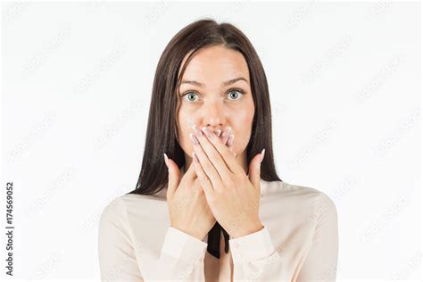 foto stock keep quiet a frightened woman covering her mouth with her hands putting her camera