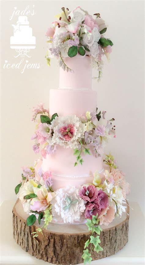 Learn how to make a rustic, homemade wedding cake in just a few simple steps. Sugar flower wedding cake Paid ponk Wow Royal icing Lily ...