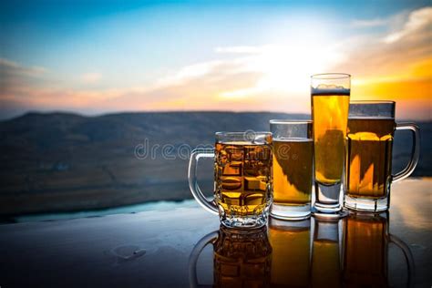 Glass Of Beer On A Beach At Sunset Cooling Summer Drink Concept Close