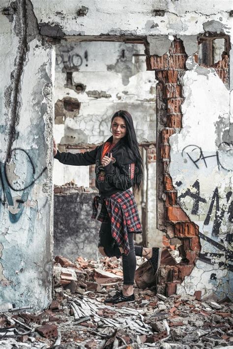 Bautiful Model Girl Posing In Old Damaged And Ruined Building Stock
