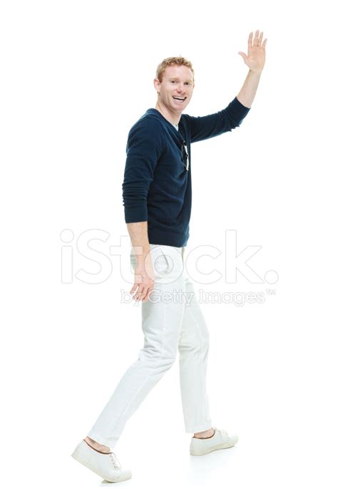 Smiling Casual Man Walking And Waving Hand Stock Photo Royalty Free