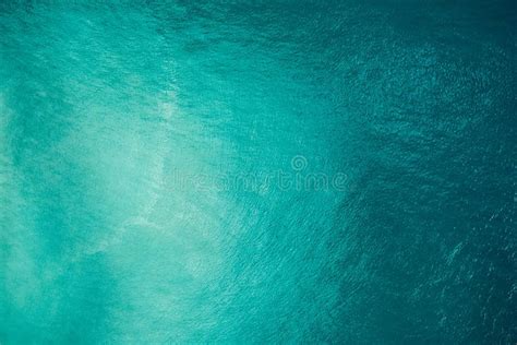Aerial View Of A Blue Sea Water Background And Sun Reflections Aerial