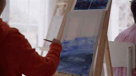 Close Up Video Of A Person Painting On Canvas · Free Stock Video