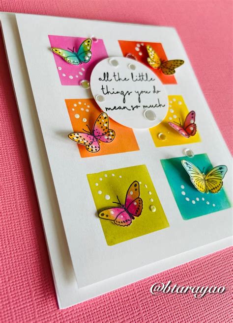 A Close Up Of A Card With Butterflies On It