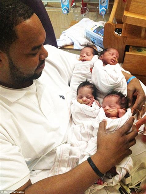 father cradles newborn quadruplets just hours after his wife died giving birth to them daily