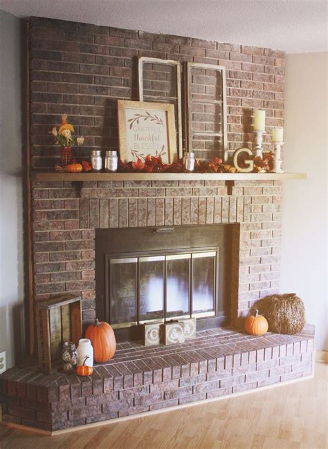 A stone facade fireplace helps warm up the all white living room designed by leanne ford. Pin on Living Room