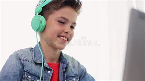 Boy In Headphones Playing Video Game On Laptop Stock Video Video Of