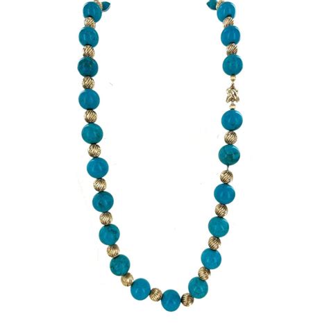tiffany and co turquoise bead 14 karat yellow gold x clasp estate necklace at 1stdibs
