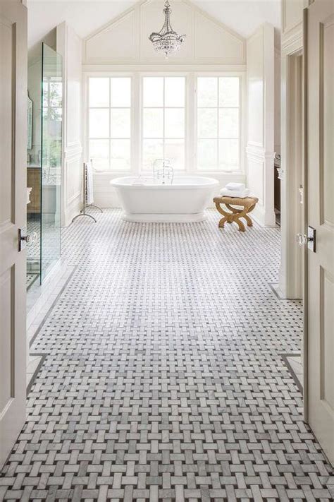 Master Bathroom With High Ceiling And Marble Basketweave Floor