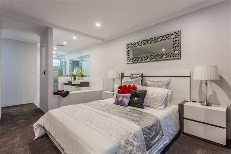 An en suite added to the eaves of a property on the 3rd floor (click link above to read about it in more detail.) How much does it cost to build a master bedroom and ...