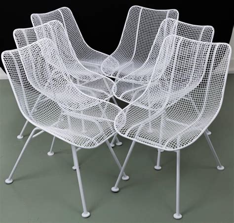 Dekker wire chair from tomado with black metal frame and white metal wire seating. Woodard Mid-Century Modern Wire Mesh Chairs at 1stdibs