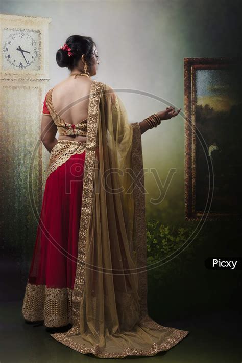 Image Of Middle Aged Indian Woman Wearing Traditional Designer Wear