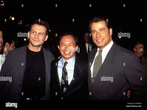 Christian Slater Director John Woo John Travolta At The Premiere Of