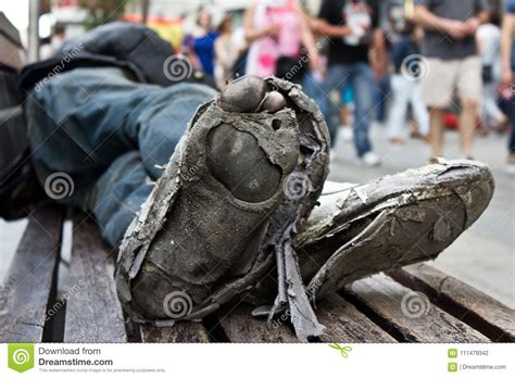 Homeless Man´s Rotten Shoes With Dirty Feet On Urban