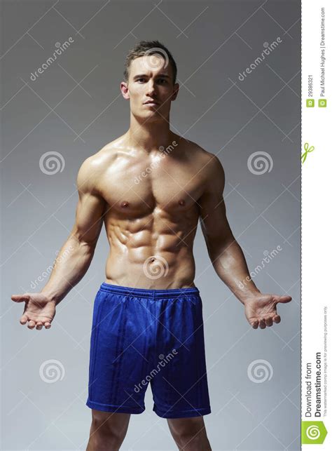 Muscular Young Man Flexing Arm Muscles Stock Image Image