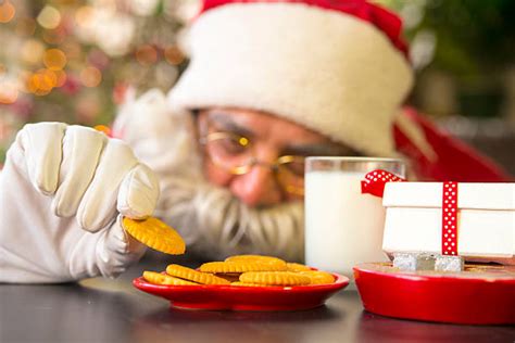 Santa Eating Cookies Stock Photos Pictures And Royalty Free Images Istock