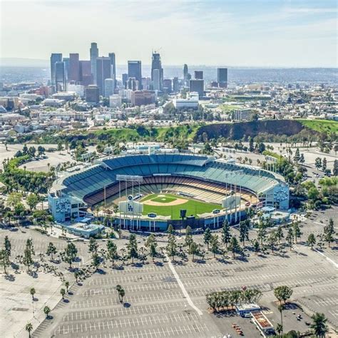 Aerial View Of The Dodgers Stadium With The Los Angeles Skyline In The