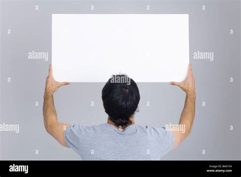 Holding Up Signs High Resolution Stock Photography And Images Alamy