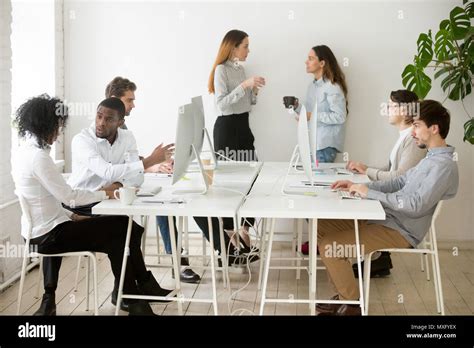 People Working Doing Different Things In Coworking Office Stock Photo