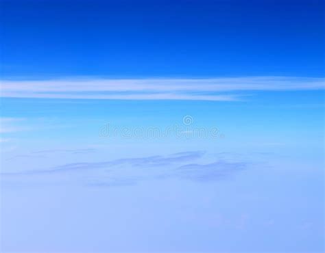 White Stratiform Clouds In Infinite Sky With Shades Of Blue Aerial