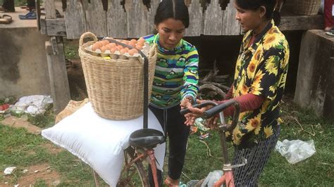 Svay Chek Villagers Load Bicycle With Donated Rice And Food Basket