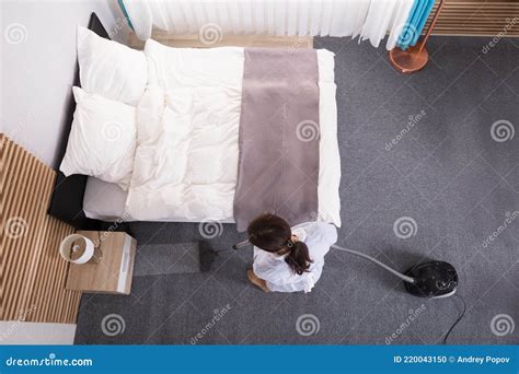 Housekeeper Cleaning Carpet With Vacuum Cleaner Stock Photo Image Of