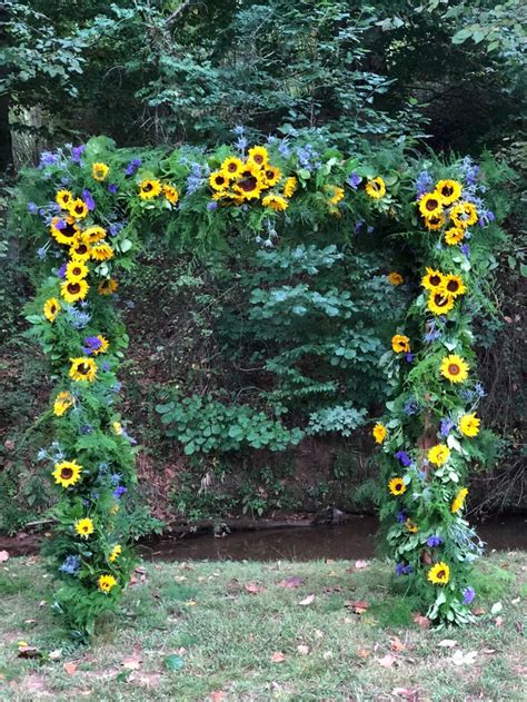 You get to choose every flower and when you're finished, secure the bunch with floral tape and wrap them with a ribbon. Sunflower wedding arbor | Sunflower wedding, Wedding ...