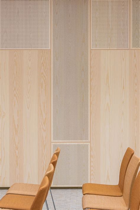 Gustafs Perforated Acoustic Wood Panels Are Cladding The Walls In This
