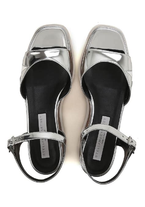 Upgrade your footwear collection by taking advantage of special shoe deals and offers. Stella McCartney vegan silver wedges sandals shoes ...