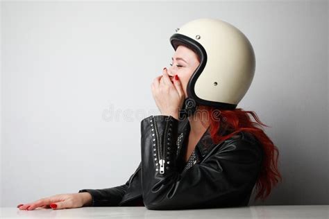 Profile Portrait Of Happy Young Biker Woman Wearing Helmet And Leather