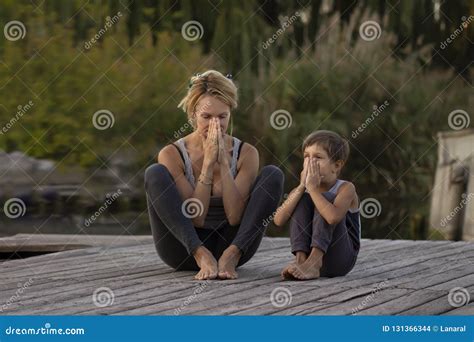 Mother And Son Exercising Yoga Pose Stock Photo Image Of Exercising Flexible